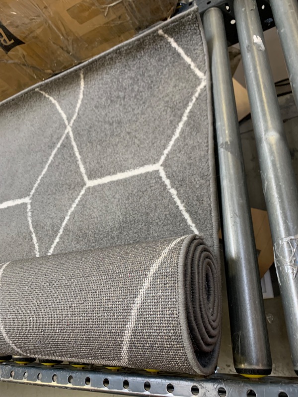 Photo 2 of 5'7' Gray Pattern Rug, No Box Packaging, Minor Use, Minor Fraying on Edges, Creases and Wrinkles in Rug, Dirty From Shipping and Handling, Tape on Rug
