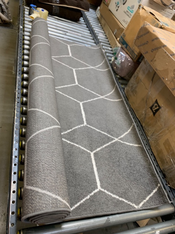 Photo 1 of 5'7' Gray Pattern Rug, No Box Packaging, Minor Use, Minor Fraying on Edges, Creases and Wrinkles in Rug, Dirty From Shipping and Handling, Tape on Rug
