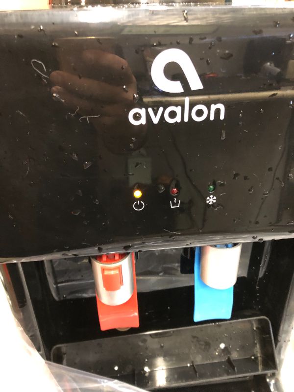 Photo 3 of Avalon Premium Hot/Cold Top Loading Countertop Water Cooler Dispenser With Child Safety Lock. UL/Energy Star Approved- Black----there is still some moisture around the item ---bottle not included 
