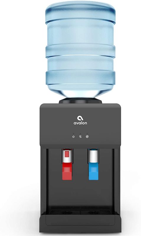 Photo 1 of Avalon Premium Hot/Cold Top Loading Countertop Water Cooler Dispenser With Child Safety Lock. UL/Energy Star Approved- Black----there is still some moisture around the item ---bottle not included 
