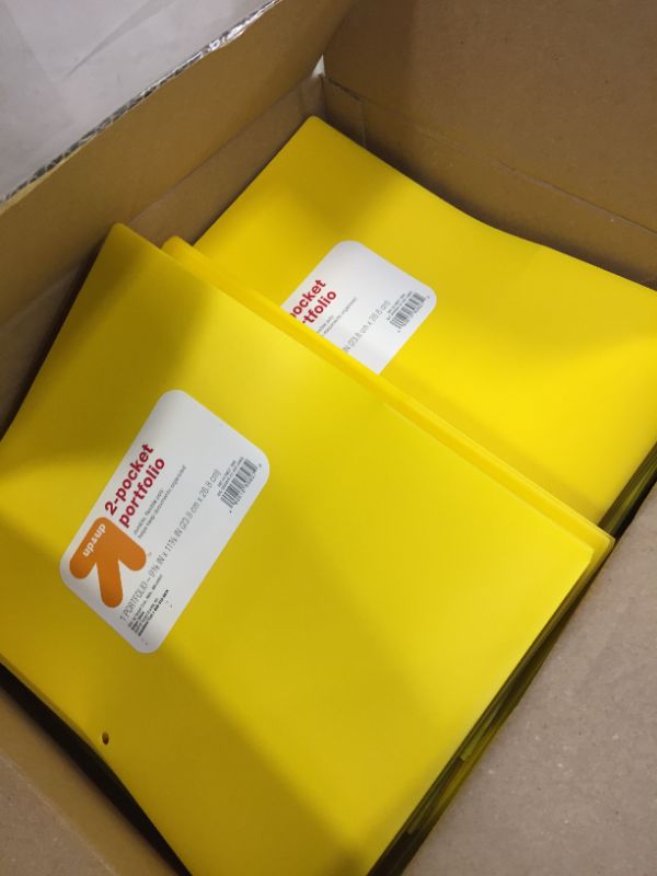 Photo 1 of box full of 2 pocket portfolios (yellow)