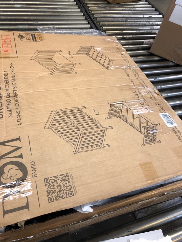 Photo 1 of Dream On Me Violet 4-In-1 Convertible Mini Crib In Black, Greenguard Gold Certified, JPMA Certified, 3 Position Mattress Height Settings, Non-Toxic Finish Black Crib-------lightly used--------missing some items and hardware/screws---------minor scuffs due