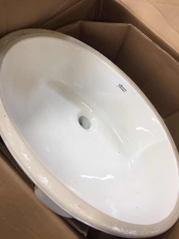 Photo 3 of American Standard 0496.300.020 Ovalyn 19-1/4 by 16-1/4-Inch Under Counter Lavatory Sink, White-------------used needs cleaning-----------missing hardware and screws 