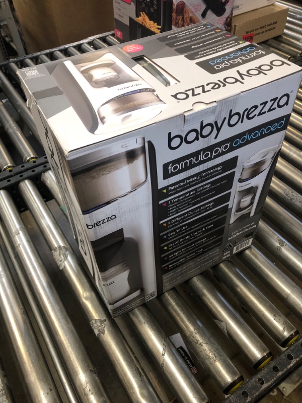 Photo 1 of New and Improved Baby Brezza Formula Pro Advanced Formula Dispenser Machine - Automatically Mix a Warm Formula Bottle Instantly - Easily Make Bottle with Automatic Powder Blending-------like new