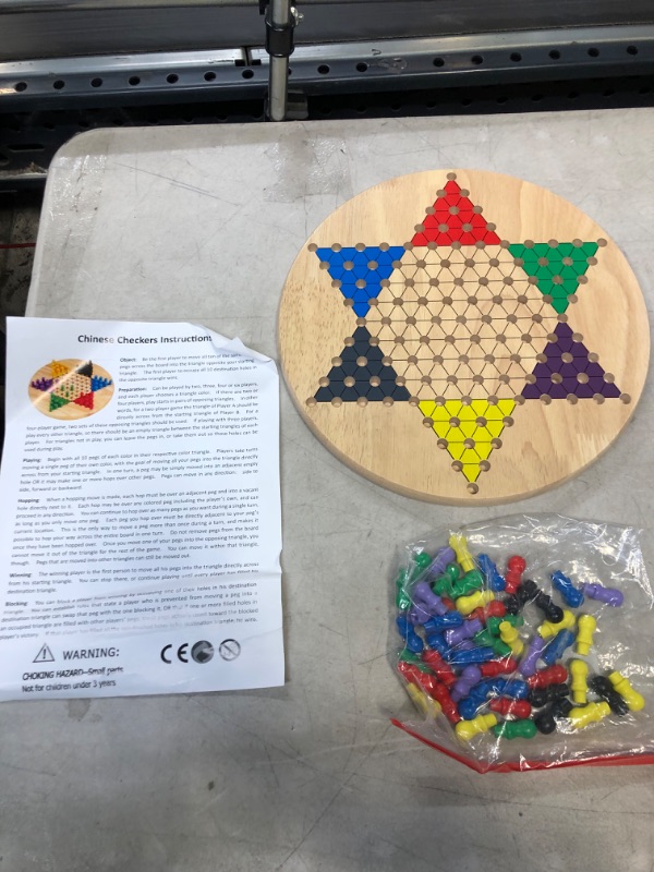 Photo 1 of Chinese checkers game board, pieces and instructions