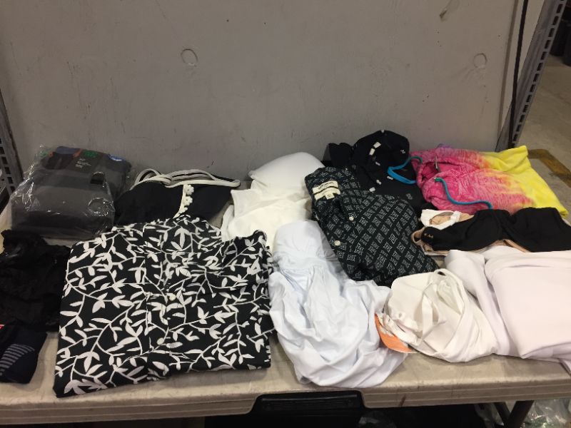 Photo 1 of bag lot of men and women clothes different styles and sizes ---sold as is --