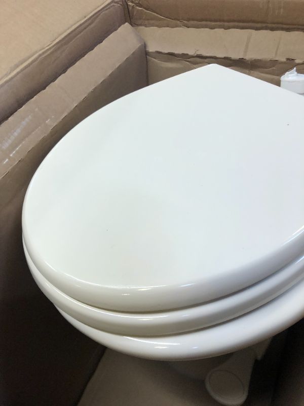 Photo 3 of Dometic 302310033 310 Series Standard Height Toilet 19.75" Height, Slow Close Wood Seat, Bone Bone Standard Height Toilet
