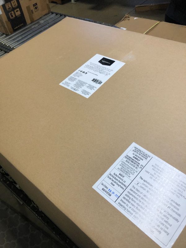 Photo 1 of Amazon Basics Big & Tall Adjustable Executive Office Chair - 500-Pound Capacity, Black Faux Leather