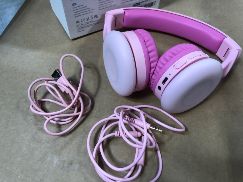 Photo 2 of BIGGERFIVE Kids Wireless Bluetooth Headphones with 7 Colorful LED Lights, 50H Playtime, Microphone, 85dB/94dB Volume Limited, Foldable On Ear Kids Headphones for School/Girls/iPad/Fire Tablet, Pink