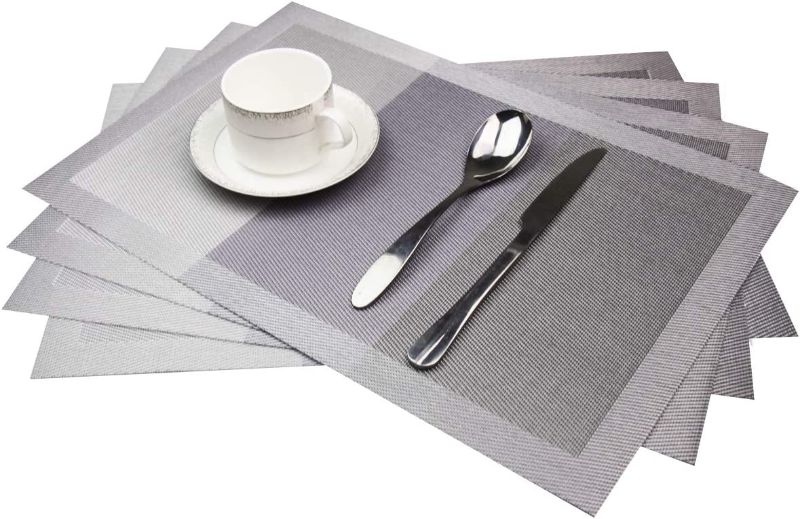 Photo 1 of GoTCele Placemats Non-Slip Heat-Insulation PVC Table Mats with Simple Stripe Design,Easy to Clean Washable Placemats for Kitchen Dining Table Set of 4 (Grey)
