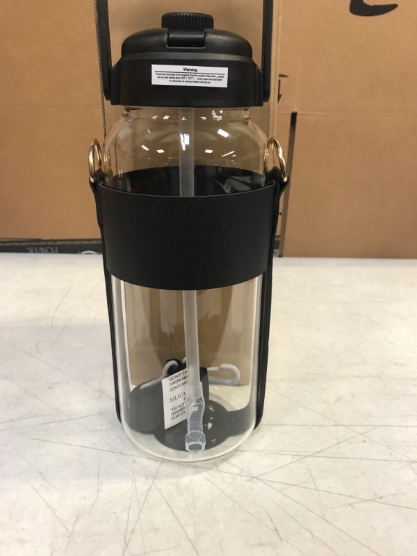 Photo 1 of 64OZ GLASS WATER BOTTLE WITH BLACK CARRYING STRAPS