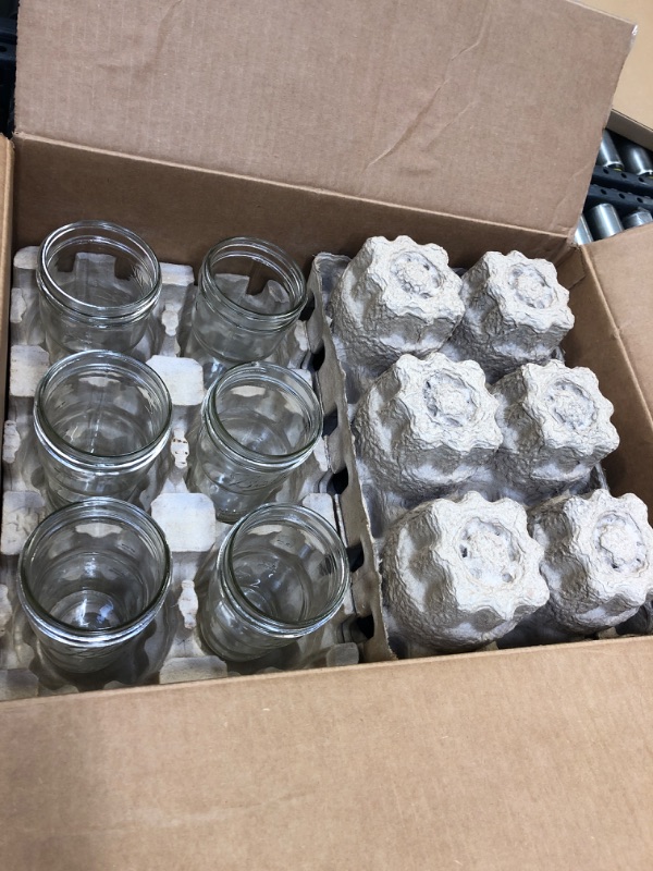 Photo 1 of 12 Glass jars with no lids 