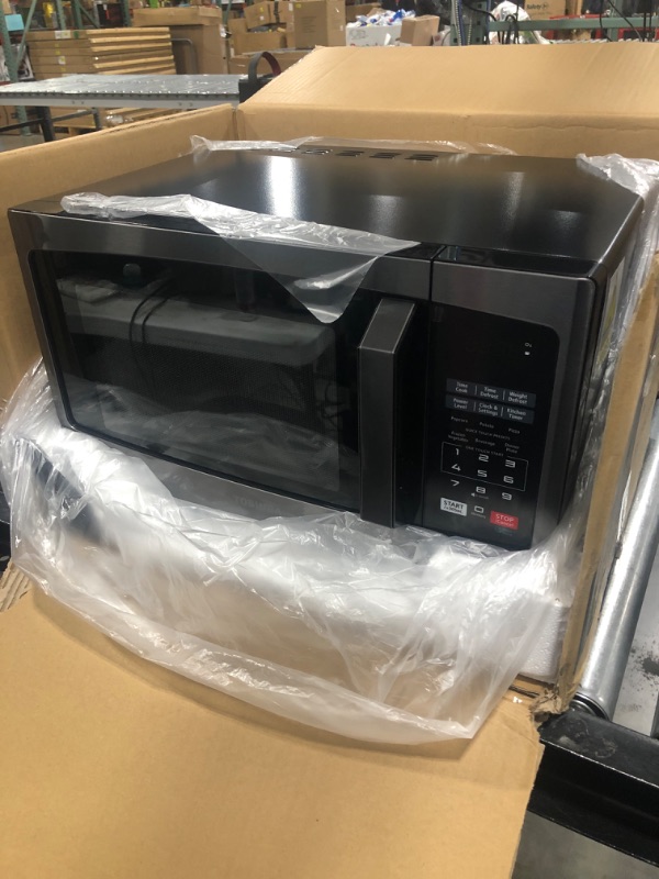 Photo 1 of TOSHIBA EM925A5A-BS Countertop Microwave Oven, 0.9 Cu Ft With 10.6 Inch Removable Turntable, 900W, 6 Auto Menus, Mute Function & ECO Mode, Child Lock, LED Lighting, Black Stainless Steel
