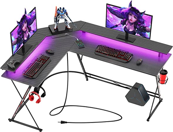 Photo 1 of SEVEN WARRIOR Gaming Desk 58” with LED Strip & Power Outlets, L-Shaped Computer Corner Desk Carbon Fiber Surface with Monitor Stand, Ergonomic Gamer Table with Cup Holder, Headphone Hook, Black
