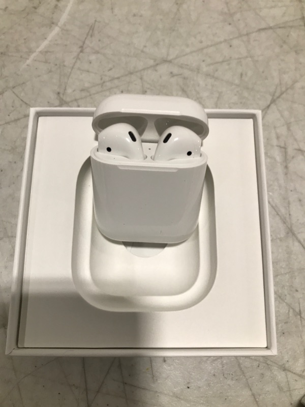Photo 1 of Apple AirPods (2nd Generation) Wireless Earbuds with Lightning Charging Case Included. Over 24 Hours of Battery Life, Effortless Setup. Bluetooth Headphones for iPhone