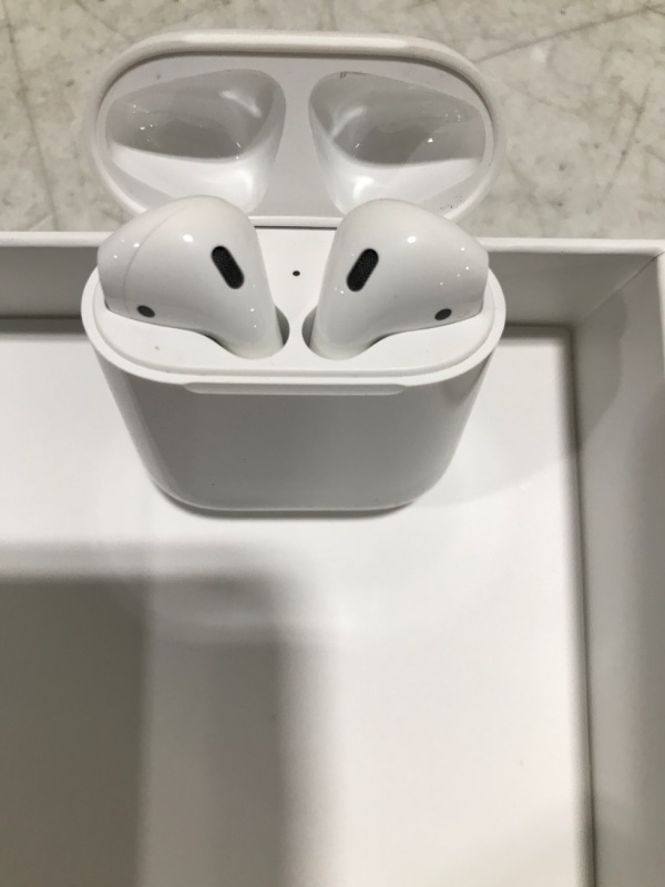 Photo 2 of Apple AirPods (2nd Generation) Wireless Earbuds with Lightning Charging Case Included. Over 24 Hours of Battery Life, Effortless Setup. Bluetooth Headphones for iPhone