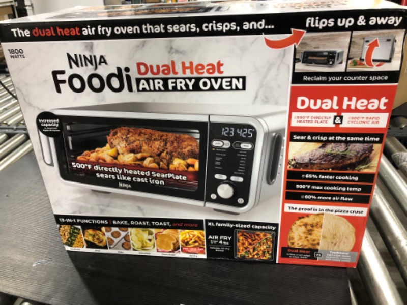 Photo 2 of *** FACTORY SEALED***-Ninja SP301 Dual Heat Air Fry Countertop 13-in-1 Oven with Extended Height, XL Capacity, Flip Up & Away Capability for Storage Space, with Air Fry Basket, SearPlate, Wire Rack & Crumb Tray, Silver 13 Functions