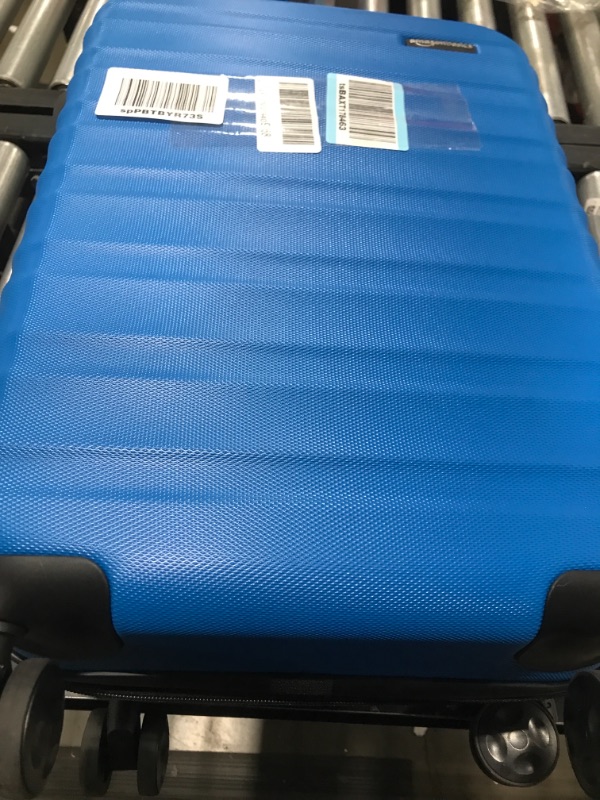 Photo 1 of Amazon Basics 21-Inch Hardside Spinner, Blue Blue 21-inch Spinner