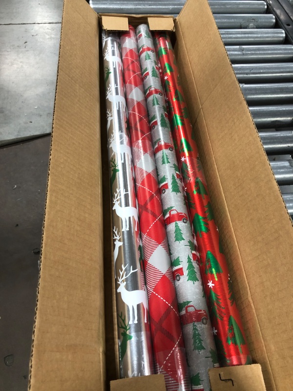 Photo 1 of American Greetings Christmas Reversible Wrapping Paper Bundle, Stripes, Polka Dots, Plaid, Reindeer, Trucks and Trees (4 Rolls, 120 sq. ft) 