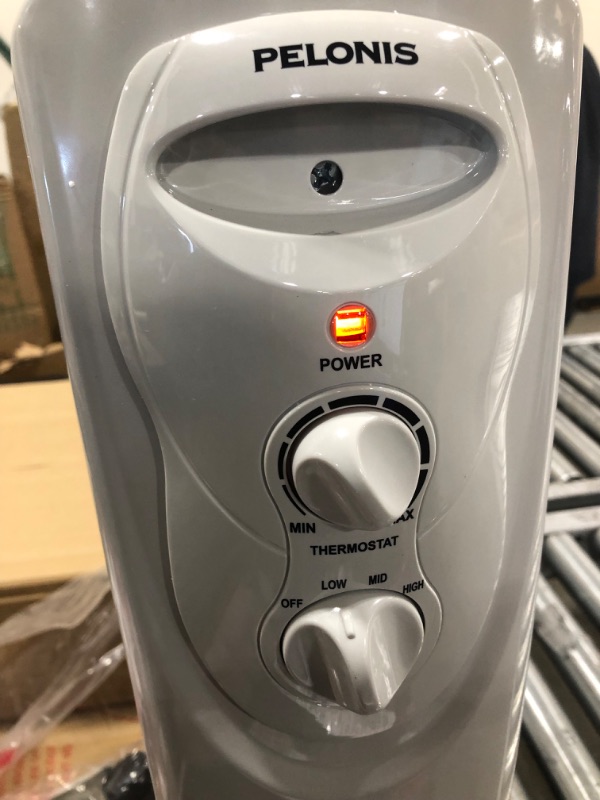 Photo 1 of PELONIS PHO15A2AGW, Basic Electric Oil Filled Radiator, 1500W Portable Full Room Radiant Space Heater with Adjustable Thermostat, White, 26.10 x 14.20 x 11.00 in