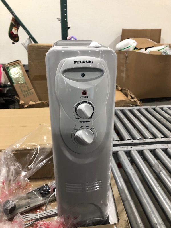 Photo 1 of PELONIS PHO15A2AGW, Basic Electric Oil Filled Radiator, 1500W Portable Full Room Radiant Space Heater with Adjustable Thermostat, White, 26.10 x 14.20 x 11.00 in