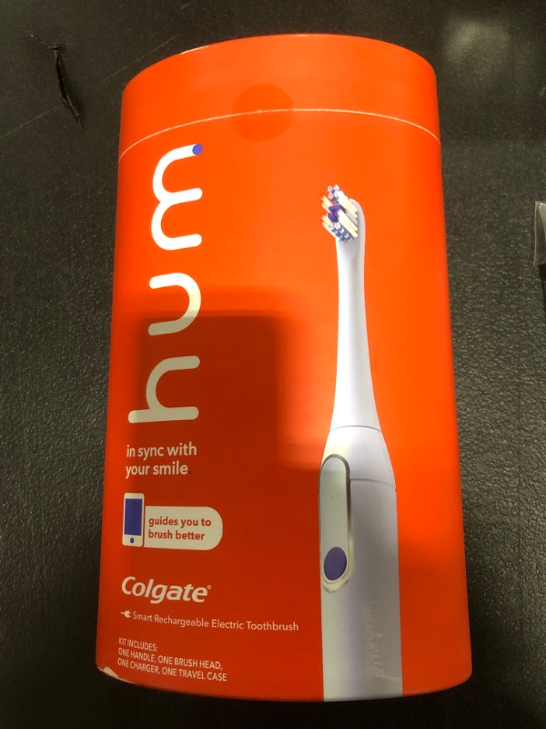 Photo 2 of hum by Colgate Smart Electric Toothbrush Kit, Rechargeable Sonic Toothbrush with Travel Case, Blue Original (1 Refill Head) Blue