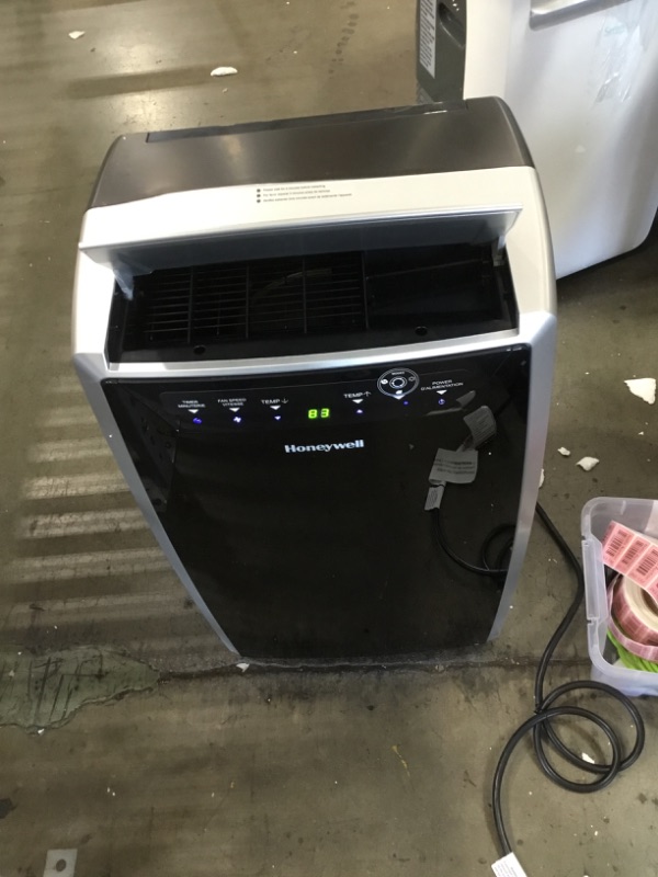 Photo 1 of 14,000 BTU Heat and Cool Portable Air Conditioner, Dehumidifier and Fan, Black/SIlver

