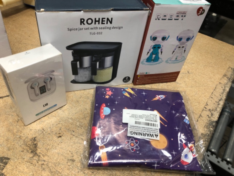 Photo 1 of assorted items for home and personal use: robot, seasoning jars, wireless earphones