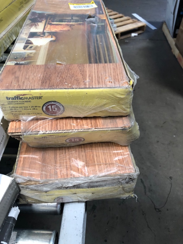 Photo 3 of 3 cases  ** minor corner damages**
TrafficMaster
Gladstone Oak 7 mm Thick x 7-2/3 in. Wide x 50-4/5 in. Length Laminate Flooring (24.24 sq. ft. / Case)