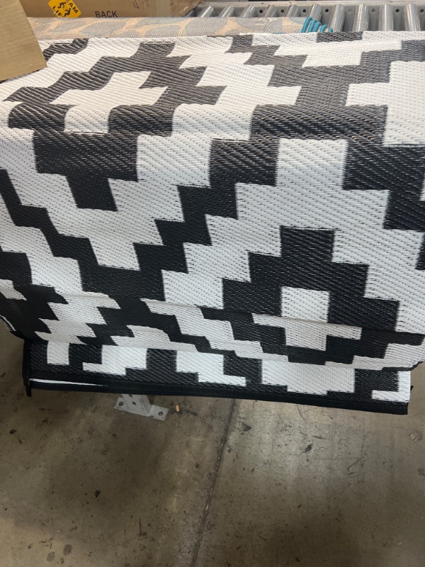 Photo 2 of 9'x6' reversible carpet- white and black 