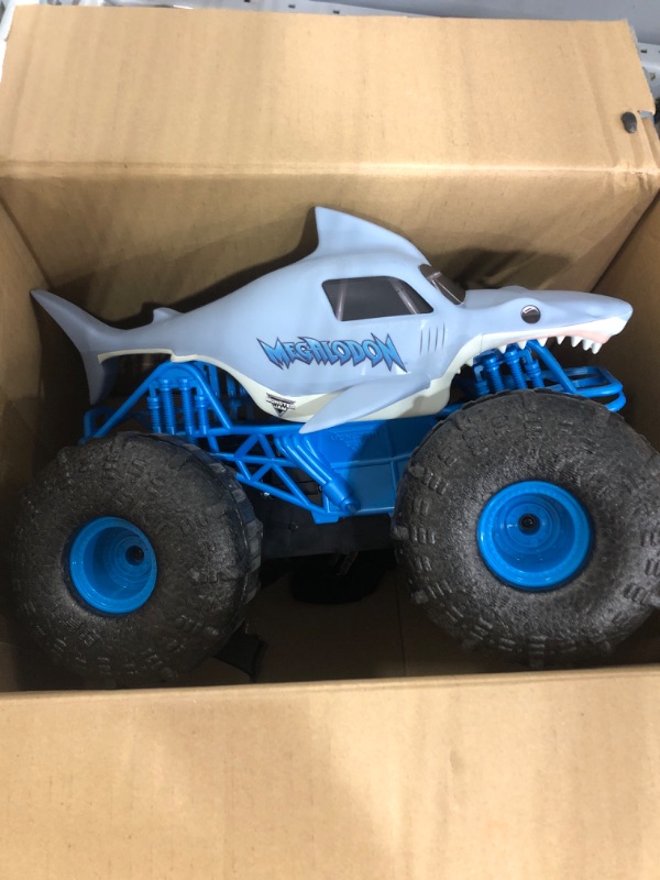 Photo 2 of BATTERIES NOT INCLUDED Monster Jam, Official Megalodon Storm All-Terrain Remote Control Monster Truck Toy Vehicle, 1:15 Scale
