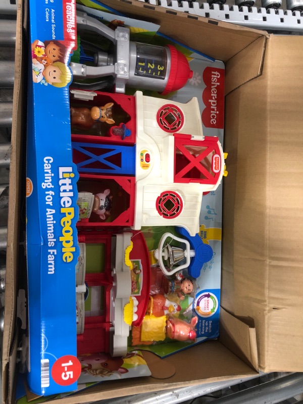 Photo 2 of Fisher-Price Little People Caring for Animals Farm Playset with Smart Stages learning content for toddlers and preschool kids
