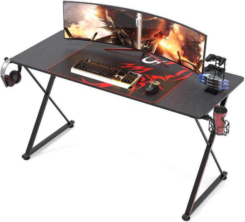 Photo 1 of DESIGNA 55'' Gaming Desk, X-Shape Computer Desk with Free Mouse pad, Cup Holder& Headphone Hook & Controller Stand, Gamer Workstation for Home Office, Black
