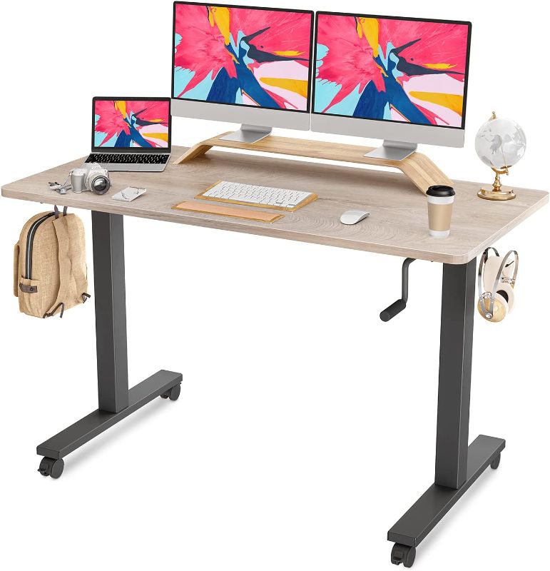 Photo 1 of **MISSING COMPONENTS**

FAMISKY Crank Adjustable Height Standing Desk, 55 x 24 Inches Manual Stand up Desk, Sit Stand Workstation for Home Office with Handle and Splice Board, Black Frame/Greige Top
