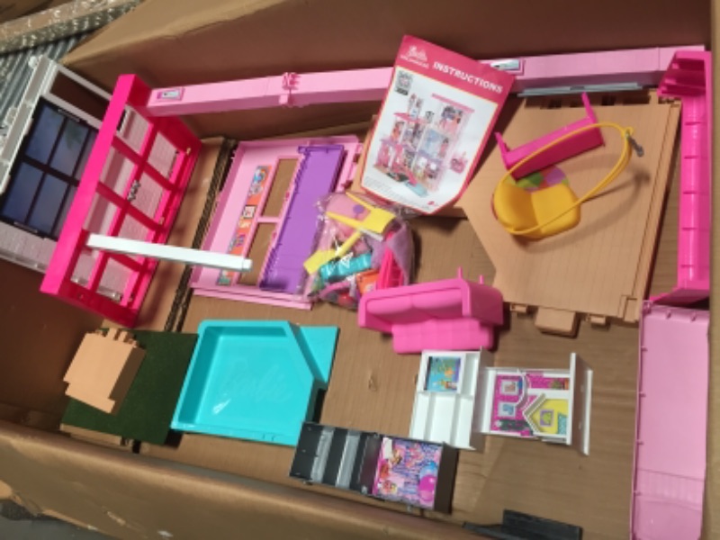 Photo 7 of Barbie Dreamhouse (3.75-ft) 3-Story Dollhouse Playset with Pool & Slide, Party Room, Elevator, Puppy Play Area, Customizable Lights & Sounds, 75+ Pieces, Gift for 3 to 7 Year Olds, New for 2021
