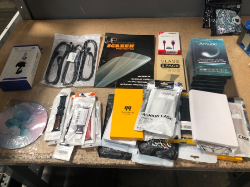 Photo 1 of BUNDLE OF (X16) DIFFERENT TYPE PHONE CASES, (X8) TEMPERED SCREEN PROTECTORS *IPHONES*, (X2) USB CHARGING CABLES *IPHONE & TYPE-C*, MOUSE PAD, (X9) WATCH BANDS, UNIVERSAL CONTROL REMOTE/GAME CONTROLLER WALL MOUNT 