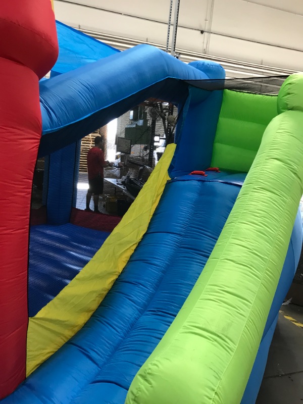 Photo 4 of Bounceland Royal Palace Inflatable Bounce House, with Long Slide, Large Bouncing Area, Basketball Hoop and Sun Roof, 13 ft x 12 ft x 9 ft H, UL Strong Certified Blower, Castle Kids Party Theme
