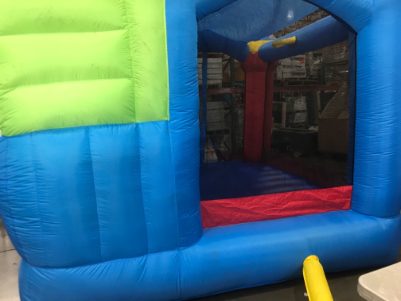 Photo 4 of **MINOR DAMAGE SMALL TEAR* Bounceland Royal Palace Inflatable Bounce House, with Long Slide, Large Bouncing Area, Basketball Hoop and Sun Roof, 13 ft x 12 ft x 9 ft H, UL Strong...
