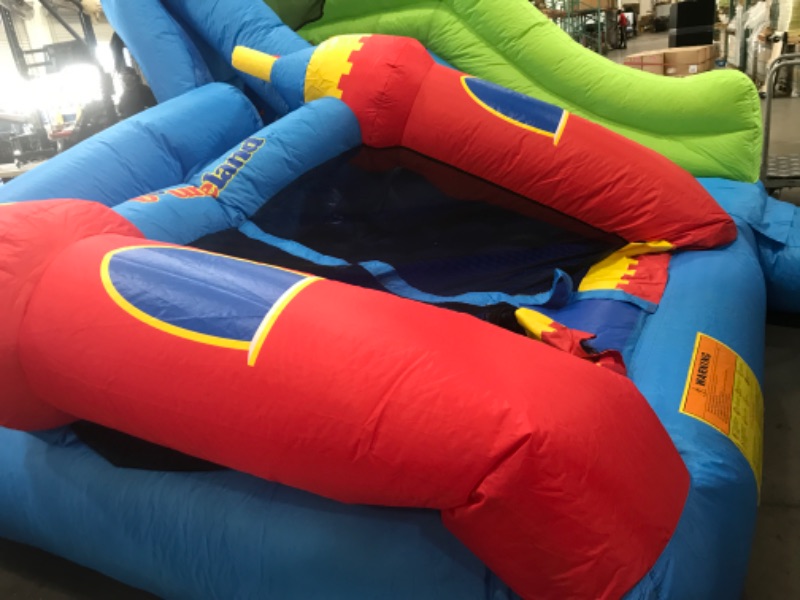 Photo 3 of **MINOR DAMAGE SMALL TEAR* Bounceland Royal Palace Inflatable Bounce House, with Long Slide, Large Bouncing Area, Basketball Hoop and Sun Roof, 13 ft x 12 ft x 9 ft H, UL Strong...
