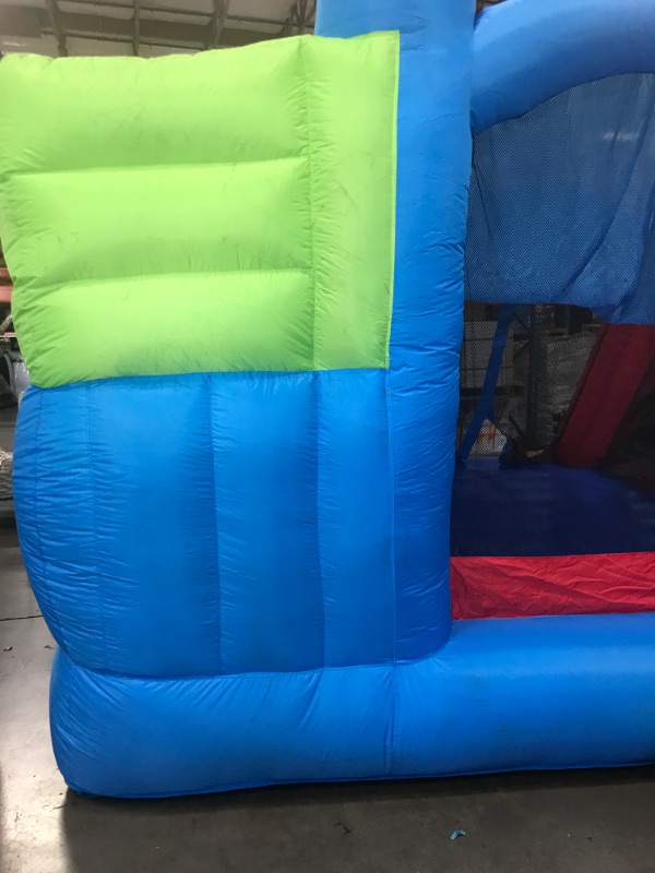 Photo 7 of **MINOR DAMAGE SMALL TEAR* Bounceland Royal Palace Inflatable Bounce House, with Long Slide, Large Bouncing Area, Basketball Hoop and Sun Roof, 13 ft x 12 ft x 9 ft H, UL Strong...
