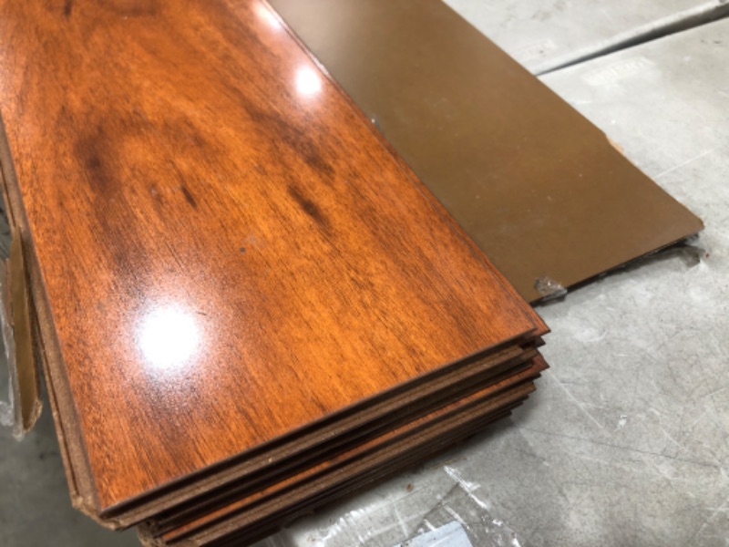 Photo 3 of **DAMAGED** TrafficMaster
High Gloss Jatoba 8 mm Thick x 5-5/8 in. Wide x 47-3/4 in. Length Laminate Flooring (18.65 sq. ft. / case)