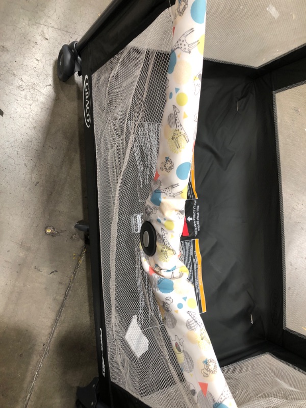 Photo 1 of ***MINOR DAMAGE** MISSING PARTS**
8 Graco Pack 'n Play Playard with Automatic Folding Feet, Carnival