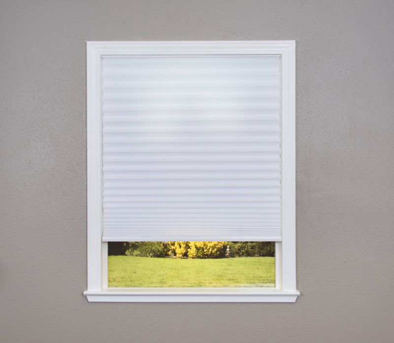 Photo 1 of *Minor damage*
Redi Shade Easy Lift Cut-to-Size White Cordless Light Filtering Fabric Pleated Shade 48 in. W X 64 in. L
