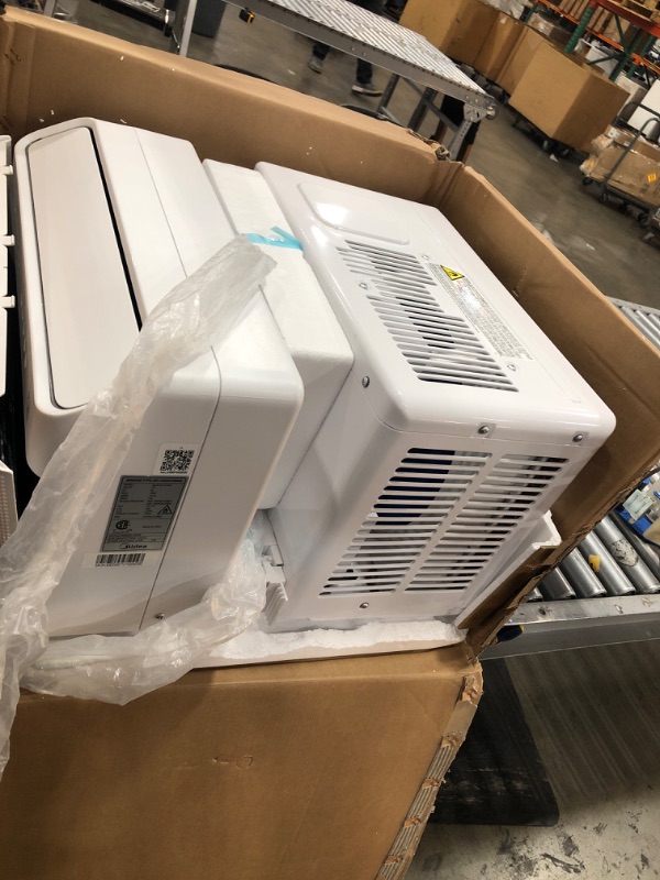 Photo 3 of TESTED POWERS ON** DAMAGED*
Midea 12,000 BTU U-Shaped Smart Inverter Window Air Conditioner–Cools up to 550 Sq. Ft., Ultra Quiet with Open Window Flexibility, Works with Alexa/Google Assistant, 35% Energy Savings, Remote Control
