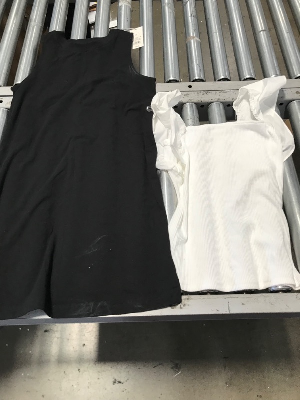 Photo 1 of ***2  WOMENS MEDIUM SHIRTS** BLACK AND WHITE