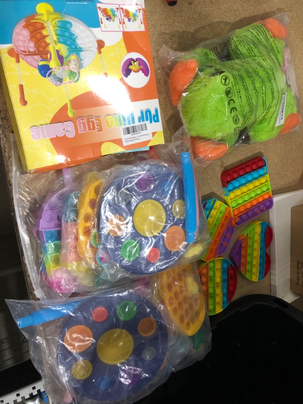 Photo 1 of Bundle of Assorted Kids toys Pop it, Plushies, etc. (8) 