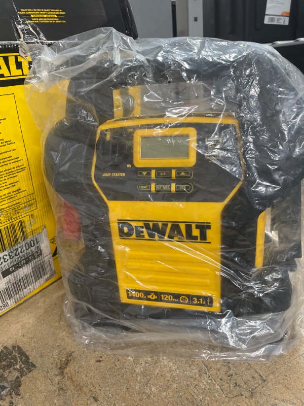 Photo 2 of **WONT HOLD CHARGE**PARTS ONLY**

DEWALT 1400 Peak Amp Portable Car Jump Starter with Digital Compressor