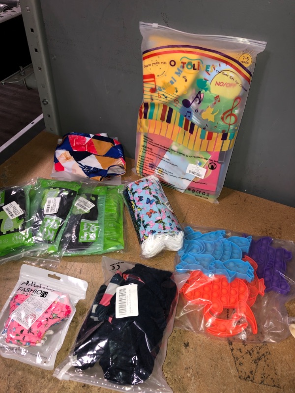 Photo 1 of *BUNDLE OF MIXED ITEMS- MUSIC FLOOR MAT, KIDS FACE MASK, POP ITS, INFANT CLOTHES,WOMENS SWIM BOTTOMS*