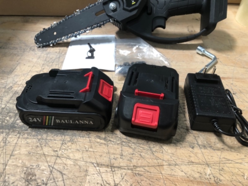 Photo 1 of Mini Chainsaw Upgraded 6-inch Battery Powered Elctric Chainsaw with 2 Battery 2 Chain, Longer Handheld Cordless Chainsaw