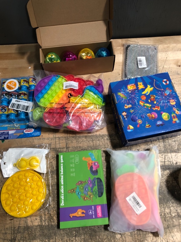 Photo 1 of Assorted Unisex Toy Bundle-Sensory, Dinosaurs, Bubbles and Games 